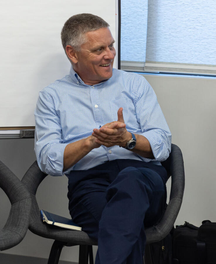 Matthew listening during a leadership workshop.